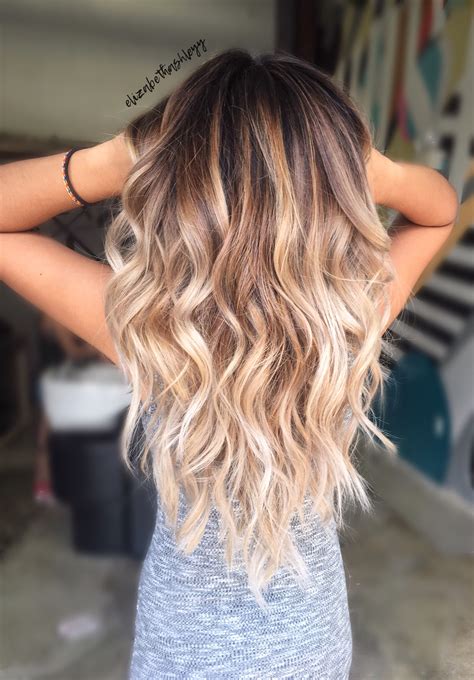 Brown to blonde ombre color features a brown hair color on top, usually reaching from the roots down to the midshaft zone. From there, a blonde shade takes over from the midshaft to ends with a smooth, blended transition zone between the two (or more!) shades.. 
