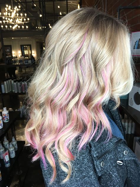 Blonde hair with light pink. People with bleached blonde hair can darken their locks by gradually dying hair darker using a hair coloring product. This can be done at home with home hair dye or by visiting a professional colorist. 