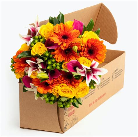Bloomsy box. Enjoy the subtle and sophisticated colors of fall in a bouquet filled with orange, yellow, and cream hues. A stunning selection of roses is surrounded by light, bright greenery. 
