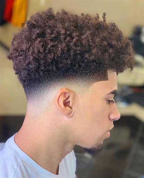 The Taper Fade Afro with a Twist is a hairstyle that combines the tapered fade cut with an Afro twist. This style features a tapered fade on both sides and back. ... The Short Blowout hairstyle is a modern and stylish haircut with short hair on top that you can style up to create a complete, voluminous look similar to the traditional blowout .... 