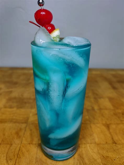 Blue mofo drink. Let's breakdown exactly how to make this summer shot. To start, combine ice and add ½ oz of each spirit, along with 1 oz blue curaçao and 2 oz of sweet and sour mix. Top with a splash of lemon-lime soda and you're ready to go. For an extra twist, try garnishing with a slice of lemon or a few blueberries. 