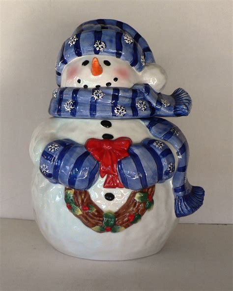 Blue snowman cookie jar. Snowman Cookie Jar – $60. The snowman wears a black robe, a witch hat, and a Gryffindor scarf. ... The second horizontal card is dark blue with Hedwig perched on a wreath of leaves, pinecones ... 
