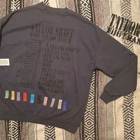 Blue taylor swift crew neck. T-Swift’s blue crewneck takes the merch crown. Taylor Swift fans stood for hours in line at the Olympic Park merchandise presales to buy the blue crewneck that everyone’s talking about. 