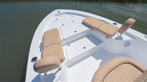 Boat bow backrest. The bow section of the boat is one to behold. It features a modular seating area that comes with removable seat bottoms. If you want to convert the area from a lounge to a dining space, there’s a dual-height cockpit table present to do just that. To sunbathe on the bow, simply center the backrest, add the filler cushions, and you’re good to go. 