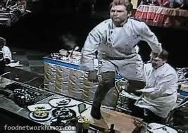 Bobby flay standing on cutting board. Once, while competing on Iron Chef Japan, Flay jumped on the counter and cutting board in celebration, much to the chagrin of his opponent, chef Masaharu Morimoto, who subsequently said that such behavior meant that Flay wasn't a true chef. "He stood on the cutting board," Morimoto said. "In Japan, the cutting board is sacred to us." 