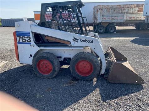 BOBCAT 763. This machine has 3700hrs. It has cab with heat. The tires are 80%. It starts easily and really runs great. Fresh change on all filters, and is ready to go to work with no fixing. Iam asking 18500 and may take a trade. Call me at show contact info. my address is 25050 hywy 169 zimmerman.. 
