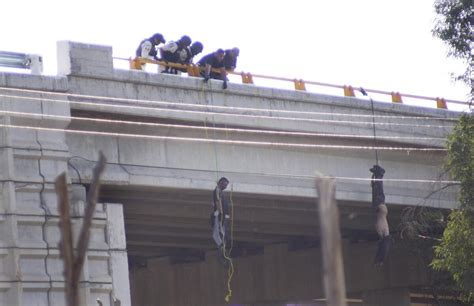 Bodies found hanging from overpass in Mexico as cartels battle for ...