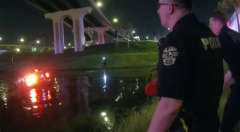 Bodycam video shows Orlando Police officers rescuing driver after SUV plunges into pond