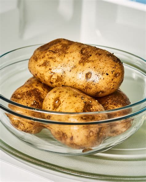 Boil potatoes in microwave. Simply place the sliced potatoes in the dish and cover with a lid or plastic wrap, leaving a small opening for steam to escape. Placing the potatoes in the microwave: Place the dish in the microwave and set the cooking time. A general rule of thumb is to cook potatoes for about 5-7 minutes per half-inch of thickness, or until they are fork ... 