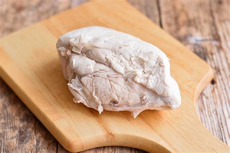 Boiling chicken for dogs. To boil chicken for your dog, place a few skinless chicken breasts in a pot. Fill it with water until the chicken is completely submerged, and let it cook for 12 minutes over high heat. … 