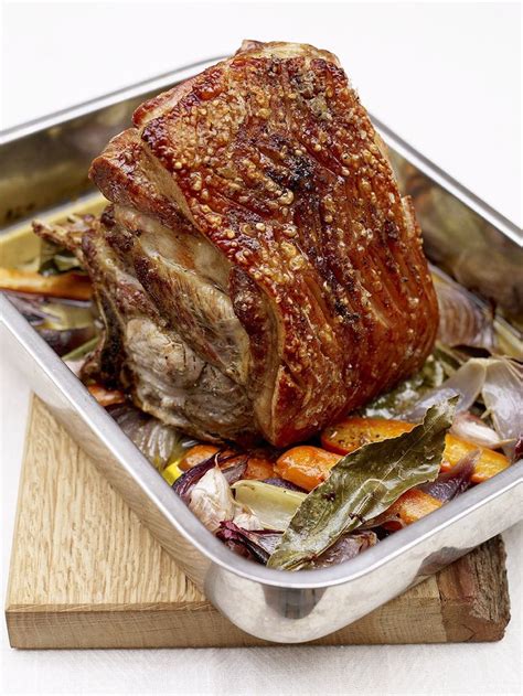 Bone in pork shoulder. Step 1 Dry pork shoulder with paper towels. Score with a sharp knife all over in a crosshatch pattern. Step 2 Pulse garlic, ¼ cup oil, cumin, salt, pepper, and oregano in a food processor until a ... 
