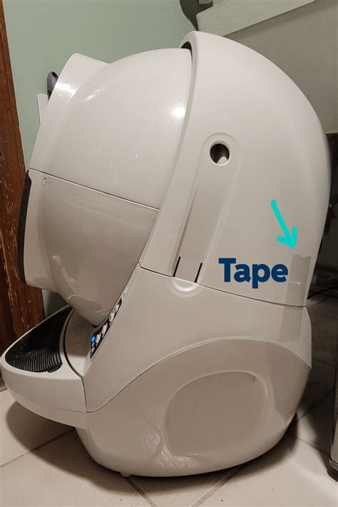 Bonnet removed litter robot. Remove the bonnet by pressing the latches on both sides of the bonnet, then lift while rotating it backward; there are two plastic tabs on the back of the bonnet that should slide up and out of the base. Set the bonnet aside. When standing in front of Litter-Robot, locate the bonnet connection terminals. 