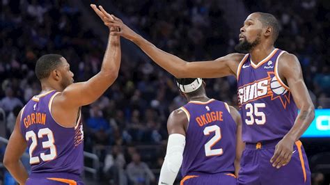Booker, Durant lead Suns past Curry and Warriors 108-104 in season opener