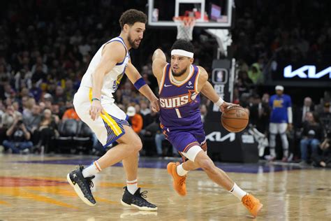 Booker scores 32, Suns hang on late to beat Warriors 119-116 on night Draymond Green ejected