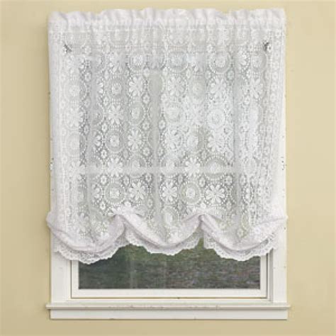 The Lorraine Adirondack tier features a windowpane pattern against a heavyweight, homespun base cloth with crocheted bottom edges. 1 Valance per package. Create the full look with the kitchen curtains (33755) and swag (33756). Shown: One valance, one swag set and one tier set. Care: Dry Clean.