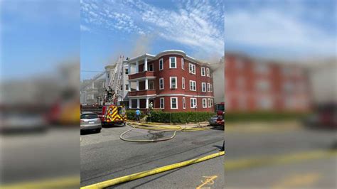 Boston fire crews battling multi-alarm blaze that spread to adjacent home