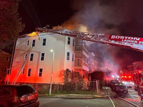 Boston firefighter injured in Mattapan blaze, 13 residents displaced after fire spread from vacant building