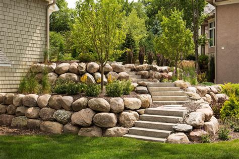 Boulder wall. BOULDER WALLS. Retaining walls can be constructed from a wide variety of materials. Boulders are an option that we see used in both residential and commercial ... 