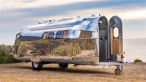 An occasion which is being marked in particularly shiny style at this year’s Pebble Beach concours event. That’s because Bentley’s biggest will tow this Bowlus Road Chief trailer to show off .... 