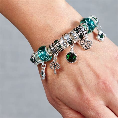 Bracelets with charms. Express Your Unique Self. Our classic expandable wire charm bangles are a perfect complement to your look. These bangles can be adorned with meaningful symbols, genuine gemstones, or mantra charms, to show the world who you are and what you represent. Whether wearing stacked or solo, these charm bangles add a special flair to any outfit. 
