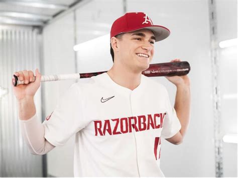 Arkansas first baseman Brady Slavens (17) hits a home run during a game against Auburn on Friday, March 17, 2023, in Fayetteville.. 