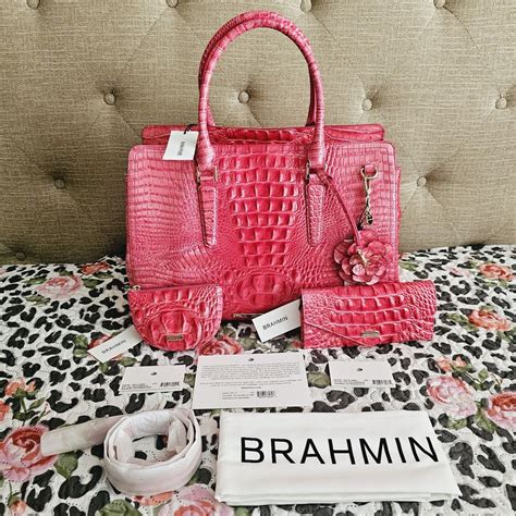 Don't miss your opportunity to add these gorgeous pink accessories to your Brahmin collection! Britt Coin Holder DIMENSIONS 5.25″ W 3.5″ H 0.7 Dahlia Tassel/Keychain Croc-embossed leather Multi levels of pedals Key clip Metal charm Approx.: 3.25" X 3". Sold by mecollier77. Fast delivery, full service customer support.. 