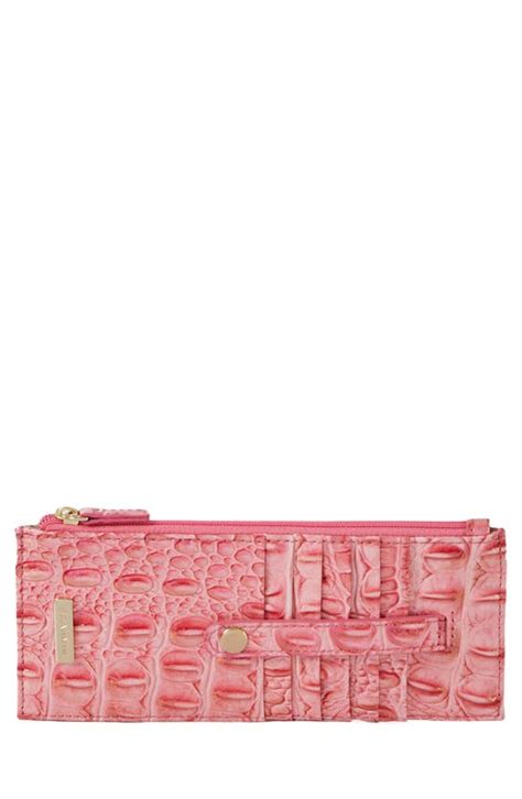 Brahmin pink punch wallet. Item #20348298 From the Melbourne Collection by BRAHMIN, the Ady Wallet features: Leather Snap closure 13 credit card slots 1 ID slot Exterior zip pocket Approx. 7.5'' W x 3.75'' H x 0.5" D Imported. Due to the nature of the materials used, each Brahmin product is one-of-a-kind. Variances in the pattern and texture of your wallet may occur. 