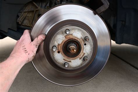 Brake rotor replacement. Lower the car onto the stand. Remove the front wheel using a 21mm deep socket with impact wrench or tire iron, you should then see this. Grab ... 