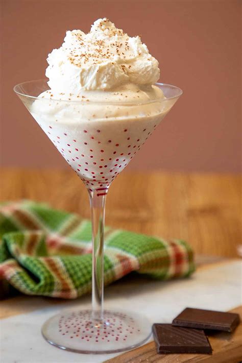 Brandy alexander with ice cream. Directions. Blend 1 ounce each of brandy and dark crème de cacao with a few scoops of vanilla ice cream, then top with whipped cream and nutmeg. Photograph by Mike Garten. 