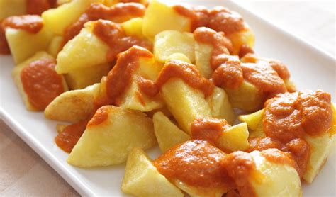 Bravas - May 29, 2019 · Once the potatoes have cooled, peel them and cut into pieces of about ½ inch (1,25 cm). Heat a good amount of extra virgin olive oil in a pan and fry the potatoes and whole garlic cloves over low-medium heat until golden brown. The oil must be very hot. Drain and place on paper towels to remove excess oil. 
