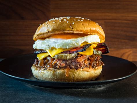 Breakfast burger. For the burgers: Gently mix together the ground beef, sausage and 1/4 teaspoon each salt and pepper. Divide the meat into 4 pieces and form each into a 4-inch patty. Melt the butter in a 12-inch ... 