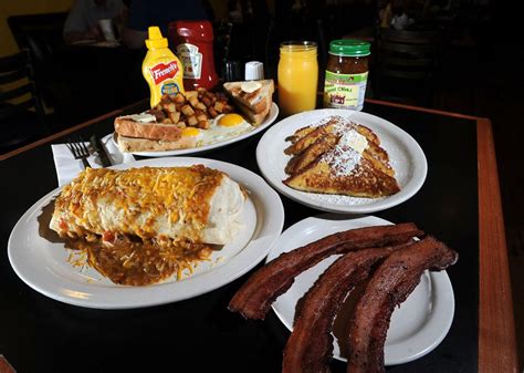 Breakfast places in colorado springs. 7587 N. Academy Boulevard. Suite 120. Colorado Springs, CO 80920. Get Directions. Make My Snooze. Phone: (719) 694-1360. Hours Today: 6:30 AM – 2:30 PM. Join Waitlist Book Reservation Weekdays Only Order Online Order Catering. 