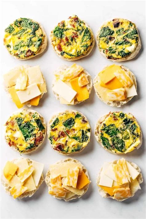 Breakfast sandwich meal prep. Preheat oven to 400 degrees F. Split English muffins and place face side up on a sheet pan, toast at 400 degrees for about 5 minutes. Place 6 mason jar rings with flats* on a sheet pan, spray well with cooking spray. Crack one egg into each ring, season with salt and pepper. 