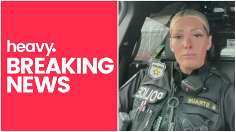 Officer Breanna Straus is seen sitting inside a vehicle while in uniform in the video. Straus urges people to move out of the way when officers are driving behind them.. 