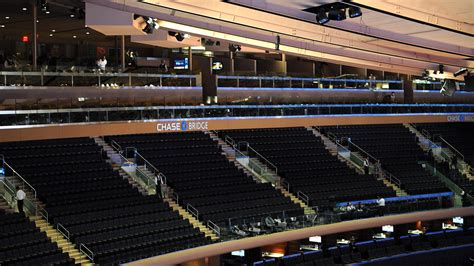 The Chase Bridge is located 94 feet above the playing surface at Madison Square Garden and is the most unique seating experience in the entire arena. The area is 233 feet long by 22 feet wide and features two rows of seats on both sides of Madison Square Garden.