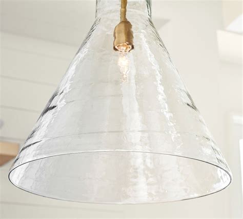 Construction Expertly crafted of steel and blown glass with a Tumbled Brass or Bronze finish. Blown clear glass shade is included. Light bulb(s) are not included. Accommodates one. 