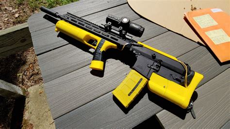 Brn-180 bullpup. As a bullpup fanatic, I'm looking into something similar. I'm considering the BRN-180, but also exploring other options cause the reciprocating CH is a non-insignificant drawback in my opinion. You should also crosspost this to r/Bullpups and shed some light on your project, there seems to be a lot of questions about SCY over there. 
