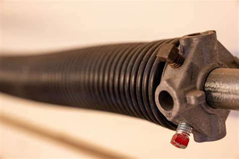Broken spring garage door. Also, make sure that the door is completely closed and turned off before you start. You can replace the torsion spring by carefully winding it onto its shaft ... 
