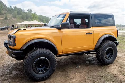 Broncos yellow. The Bronco Heritage two-door starts at $45,900 with the 2.3-liter seven-speed stick, up from $44,960 for a Big Bend with Sasquatch and the auxiliary switches package (add about $2,100 for the four ... 