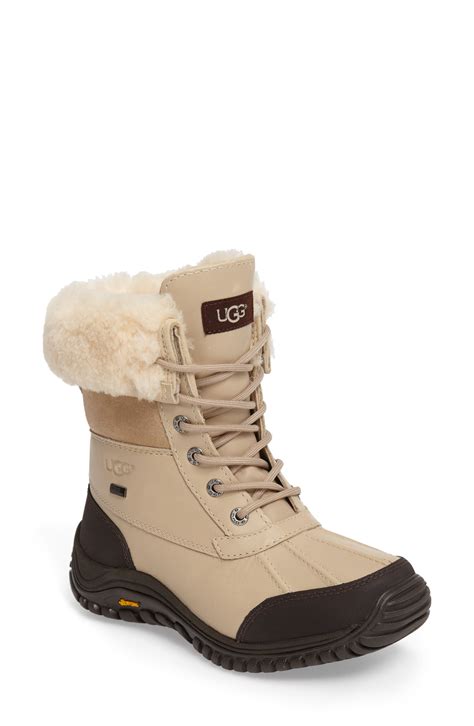 Free shipping and returns on UGG® Bailey Bow II Genuine Shearling Boot at Nordstrom.com. <p>A pair of satin bows adorns the back of a supremely cozy short boot featuring a plush lining made from genuine shearling. Pretreated to repel water and stains, the boot also features a Treadlite by UGG™ sole for added cushioning, traction and …. 