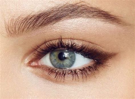 Brown eye liner. Smudge out the bottom lash line and extend the shadow beyond the eyelid to the outer edge, creating a soft wing. You can go as subtle or bold as you like, and the smoky chocolate tones here really help to show off your brown eyes. Defined brows and nude lips complete the look. 12 of 42. 