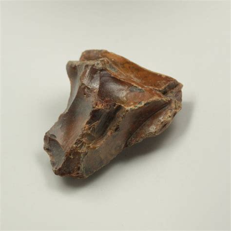 Brown flint rock. All of the rock should be given 24 to 48 hours of drying time at 205° F before raising the temperature above 210° F. In general, the darker the color, the lower the temperature needed for treatment. The smooth, dark gray or dark brown flint cooks nicely at 350° to 400°F. 