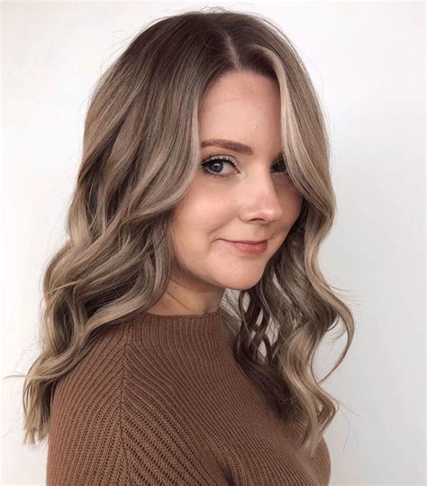 Brown hair dye over blonde. 7. Brown And Blonde Ombre. @kaansevinch. Light brown hair can look a little dull and lackluster, but when you combine it with bright butter blonde, it’s the perfect background that allows the blonde to shine. 8. Brown Hair With Slim Money Pieces. @hairbyashleyfillip. 