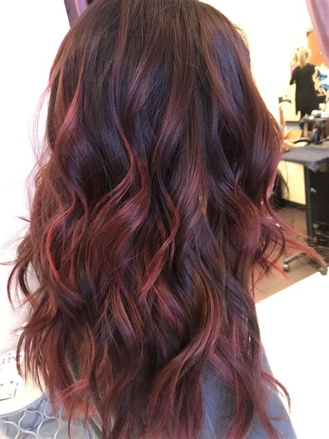 The intense dark brown is made more playful with the addition of magenta peekaboo highlights. @elissawolfe. 10. Purple Lowlights with Silver Hair. Silver hair has become a chic color choice for women of all ages. It is also a great base for adding an array of pastel peekaboo lowlights.. 
