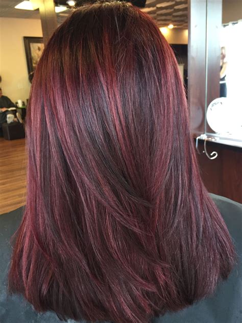 Brown hair with burgundy lowlights. 