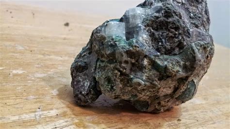 Kimberlite is the name given to a silica-poor and magnesium-rich extrusive igneous rock (e.g., a volcanic rock) that contains major amounts of olivine, often serpentinized. It is a highly variable mixture of melt, minerals crystallizing from the melt, and foreign crystals and rock pieces.