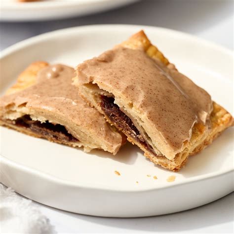 Brown sugar cinnamon pop tarts. Instructions. Preheat oven to 325℉ and line an 8x8 pan with parchment paper. In a stand mixer, cream together the coconut oil and sugar until creamy. Add in the powdered sugar and vanilla until well combined. Mix in the flour. 