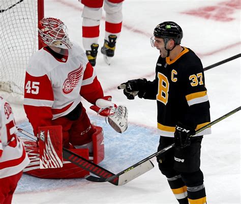 Bruins come back to beat Wings, 3-2, for 50th win