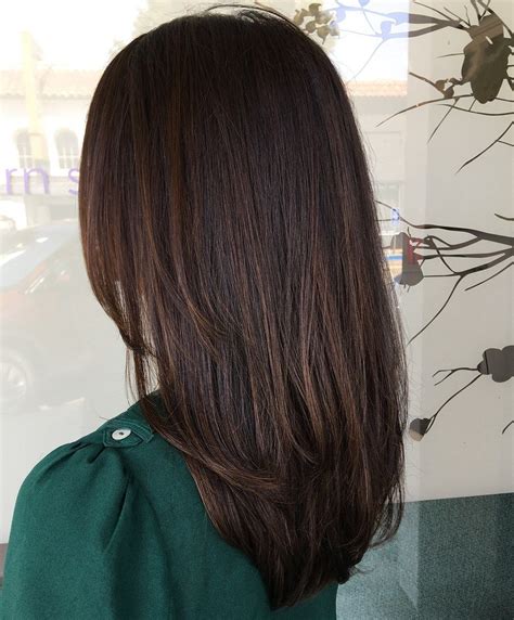 a dark brown wavy bob with caramel highlights is a lovely and chic idea that looks effortless and awesome. a dark brunette chin-length bob with wispy bangs is a nice idea for any hair thickness and most of face shapes. a dark brunette ear-length bob with a classic fringe and a messy volume is a cool solution and this hair is easy to style.. 