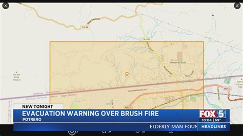 Brush fire near border prompts evacuation warning